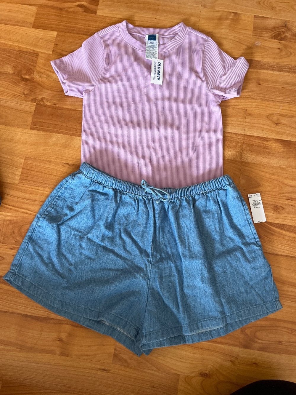 Short sleeve lilac short, with cozy denim shorts. Brand New, tags, never worn.